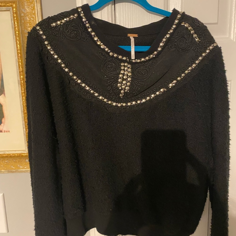 Free People black long sleeve shirt with silver trimmings.